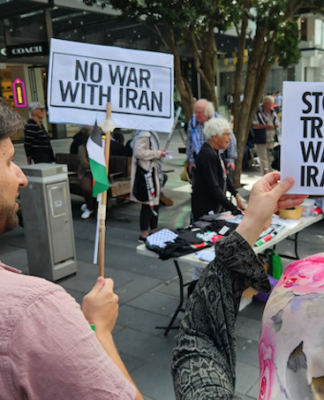 Protesters at a New Zealand rally against the US-Israel war on Iran and the Israeli genocide in Gaza