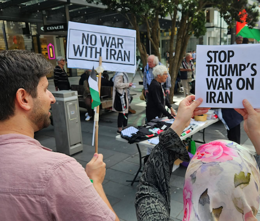Protesters at a New Zealand rally against the US-Israel war on Iran and the Israeli genocide in Gaza
