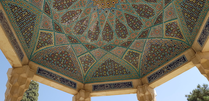 The ornate copper dome of the memorial tomb for the 14th-century Persian poet Hafez