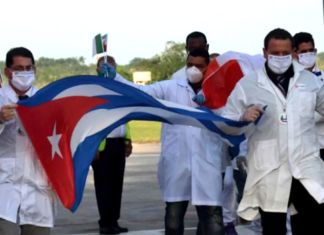 The world owes Cuba a debt – and the US a condemnation Cuban doctors arriving back from Italy following the covid outbreak in 2020