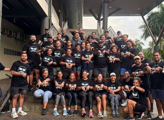 Fiji media workers of the Fijian Media Association celebrate a belated World Press Freedom Day in the capital Suva