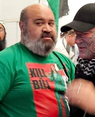 Gaza freedom flotilla activist Hāhona Ormsby (right) being welcomed home at Auckland International Airport on Sunday
