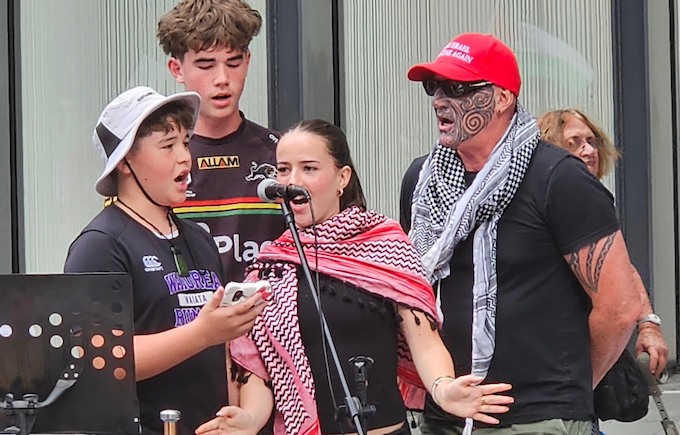 Hahona Ormsby (red cap) and the Ormsby solidarity singers