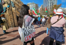 "I stand against genocide" placard at a Stop Wars protest in Auckland's Aotea Square last month