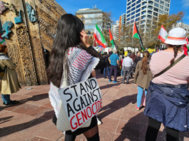 "I stand against genocide" placard at a Stop Wars protest in Auckland's Aotea Square last month