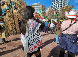 "I stand against genocide" placard at a Stop Wars protest in Auckland's Aotea Square last month