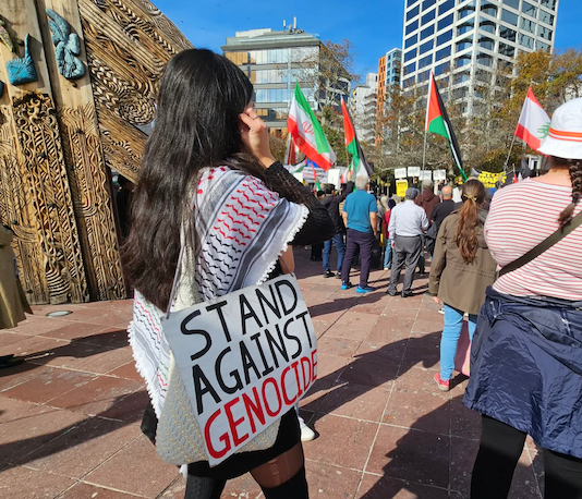 "I stand against genocide" placard at a Stop Wars protest in Auckland's Aotea Square last month
