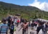 Video footage obtained by human rights researchers shows a crowd of angry Papuans throwing stones towards police infrastructure in Kobakma