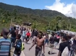 Video footage obtained by human rights researchers shows a crowd of angry Papuans throwing stones towards police infrastructure in Kobakma