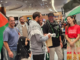 Haka, waiata welcome for NZ’s Gaza flotilla activists after brutal ordeal at hands of Israeli military Olivia Coote presents a welcome home koha to Global Sumud Flotilla activists Mousa Taher (centre) and Hāhona Ormsby (black cap) at Auckland International Airport