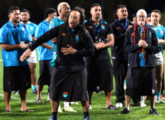Moana Pasifika head coach Tana Umaga sings and dances along to a cultural song after Saturday's Super Rugby Pacific Round 15 match