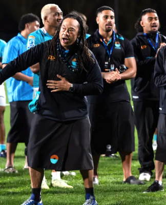 Moana Pasifika head coach Tana Umaga sings and dances along to a cultural song after Saturday's Super Rugby Pacific Round 15 match