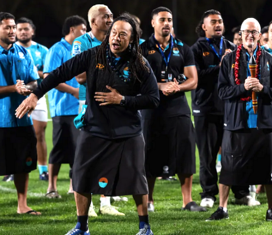 Moana Pasifika head coach Tana Umaga sings and dances along to a cultural song after Saturday's Super Rugby Pacific Round 15 match