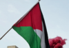 Pro-Palestine protesters set off a blood-red flare outside the US Consulate in the peaceful March for Peace demonstration in Auckland