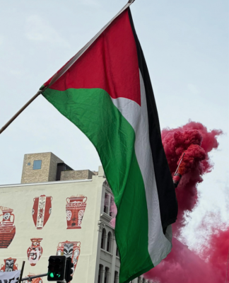 Pro-Palestine protesters set off a blood-red flare outside the US Consulate in the peaceful March for Peace demonstration in Auckland