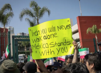 Fans bid farewell to the Iranian team’s players outside their hotel in Tijuana, Mexico