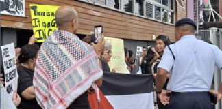 Fiji police questioning protesters at the pro-Palestine picket across the street from the new Israeli Embassy in Suva being officially opened today