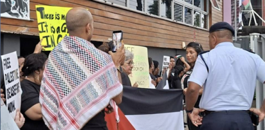 Fiji police questioning protesters at the pro-Palestine picket across the street from the new Israeli Embassy in Suva being officially opened today