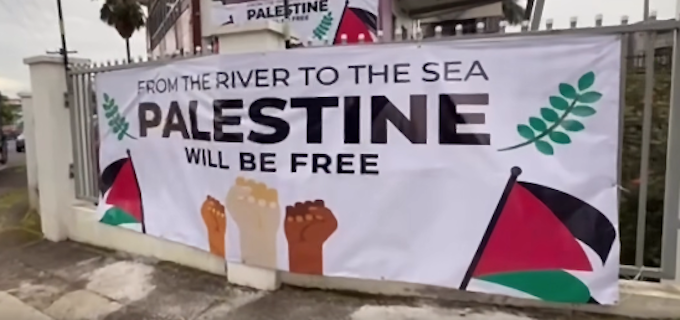 The "From the river to the sea, Palestine will be free" banner removed by police at the Fiji protest