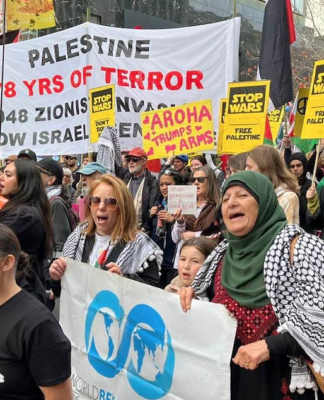 “Palestine - 78 years of [Israeli] terror” and "Aroha trumps arms" banners at the Auckland June 20 March for Peace