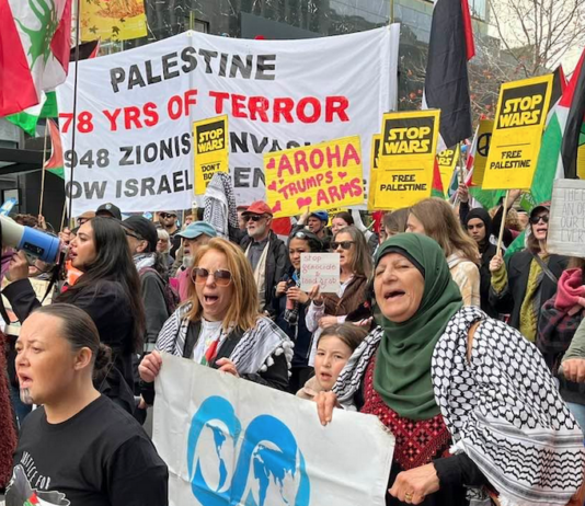 “Palestine - 78 years of [Israeli] terror” and "Aroha trumps arms" banners at the Auckland June 20 March for Peace