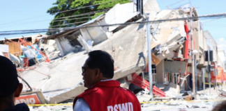 Government field officers assess the condition of communities and collapsed structures in General Santos City