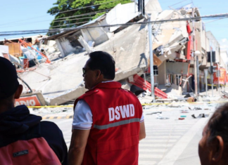 Government field officers assess the condition of communities and collapsed structures in General Santos City
