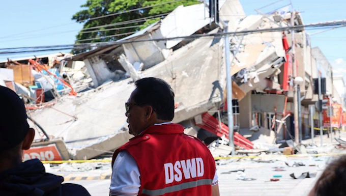 Government field officers assess the condition of communities and collapsed structures in General Santos City