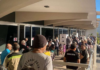 Nouméa voters queue at the Town Hall after polling places opened