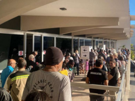 Nouméa voters queue at the Town Hall after polling places opened