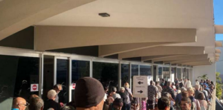 Nouméa voters queue at the Town Hall after polling places opened