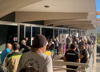 Nouméa voters queue at the Town Hall after polling places opened