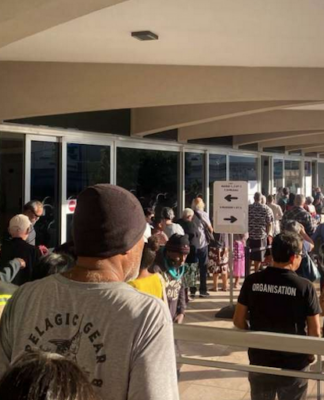 Nouméa voters queue at the Town Hall after polling places opened