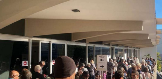 Nouméa voters queue at the Town Hall after polling places opened