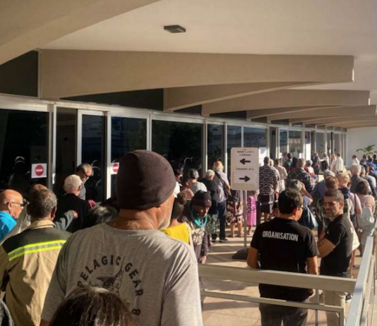 Nouméa voters queue at the Town Hall after polling places opened