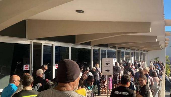 Nouméa voters queue at the Town Hall after polling places opened