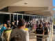 Nouméa voters queue at the Town Hall after polling places opened