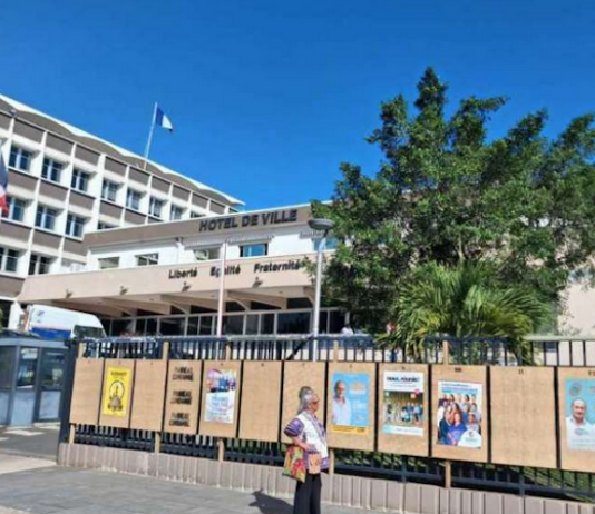 Political party posters on display at the Nouméa Town Hall