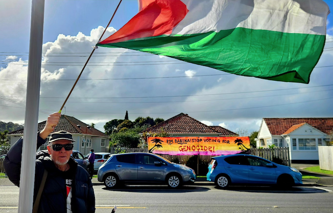 A Palestine flag and "no genocide" banner outside the Fiji consulate in Auckland's Mt Roskill