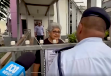 Fiji police talk to a Palestine protest organiser, Fiji Women's Crisis Centre coordinator Shamima Ali