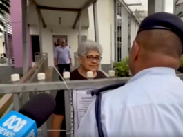 Fiji police talk to a Palestine protest organiser, Fiji Women's Crisis Centre coordinator Shamima Ali