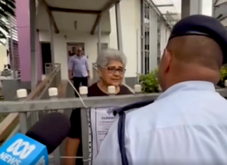 Fiji police talk to a Palestine protest organiser, Fiji Women's Crisis Centre coordinator Shamima Ali