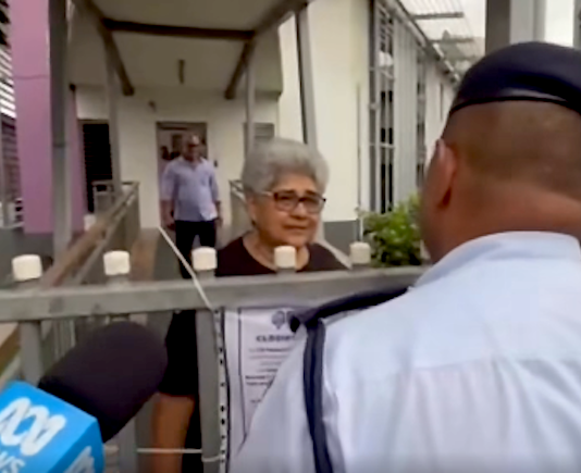 Fiji police talk to a Palestine protest organiser, Fiji Women's Crisis Centre coordinator Shamima Ali