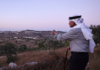 Olayan Olayan, who was born in the village of Battir in 1941, overlooks a valley in which a new Israeli settler outpost is built