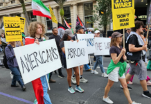 Protesters from Americans Abroad Against the War (AAAW) taking part in a recent Auckland march against the US war on Iran