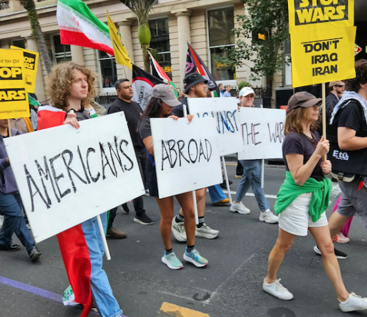 Protesters from Americans Abroad Against the War (AAAW) taking part in a recent Auckland march against the US war on Iran