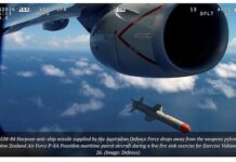 An AGM-84 Harpoon anti-ship missile supplied by the Australian Defence Force drops from an RNZ Air Force Poseidon patrol aicraft during a love fire exercise