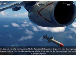 An AGM-84 Harpoon anti-ship missile supplied by the Australian Defence Force drops from an RNZ Air Force Poseidon patrol aicraft during a love fire exercise
