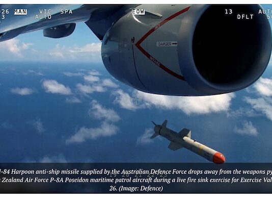 An AGM-84 Harpoon anti-ship missile supplied by the Australian Defence Force drops from an RNZ Air Force Poseidon patrol aicraft during a love fire exercise