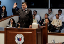 Filipino National Bureau of Investigation Director Melvin Matibag takes an oath before testifying